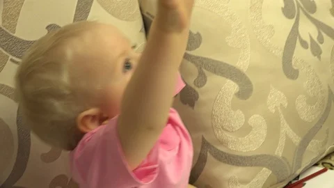 Happy Child Sitting on a Bed, Crazy Emotions. 4K UltraHD, UHD Vídeos de archivo 82460845