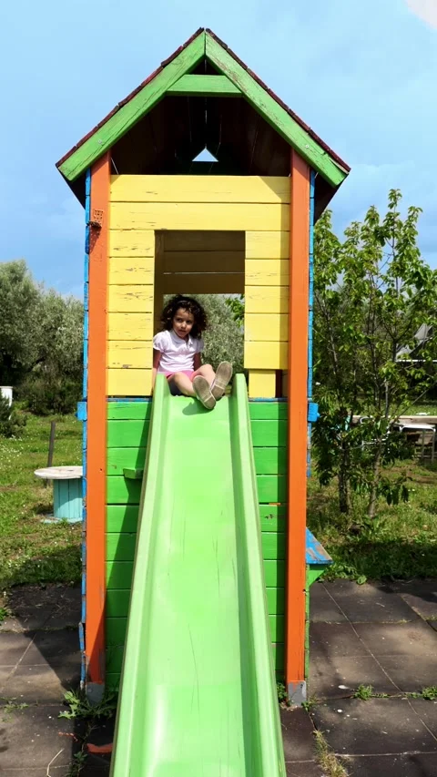 Happy child slides toward camera laughing from underneath perspective Stock Footage 308019348