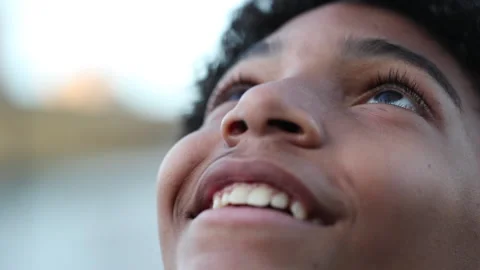 Happy child smiling and looking at sky Stock Footage 144229062