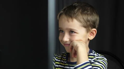 Happy child spends time at the computer. Home distance learning. The child plays Video stock 146805097