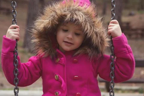 Happy Child on the Swing at Autumn Time Stock Photos