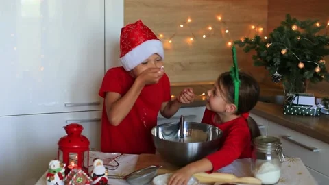 Happy children are preparing gingerbread on the eve of new year. Video stock 140369207