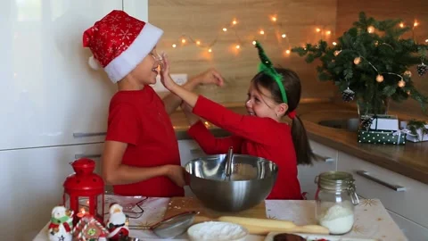 Happy children are preparing gingerbread on the eve of new year. Video stock 140369348