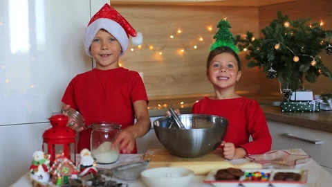 Happy children are preparing gingerbread on the eve of new year. Stock Footage 140369440