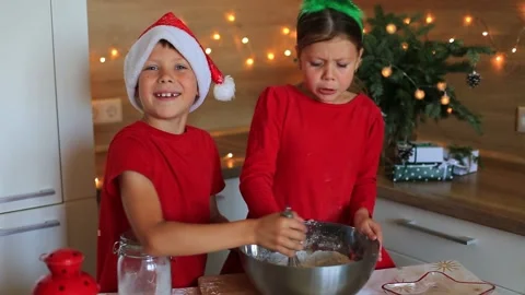 Happy children are preparing gingerbread on the eve of new year. Video stock 140369639