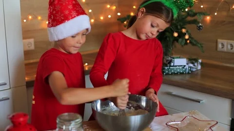 Happy children are preparing gingerbread on the eve of new year. Video stock 140369693