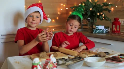 Happy children are preparing gingerbread on the eve of new year. Video stock 140369854
