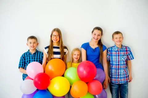Happy children with balloons Stock Photos