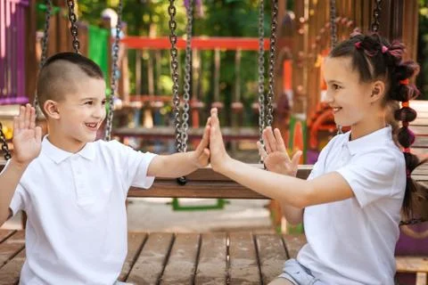Happy children clapping hands Stock Photos