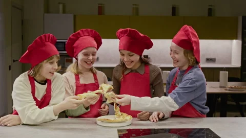 Happy Children in Culinary Class Eating Freshly Baked Pizza Stock Footage 339464655