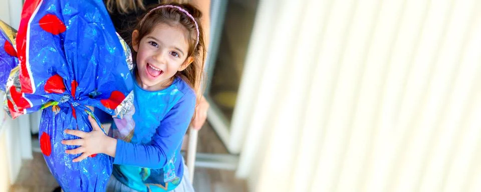 Happy children easter egg background horizontal with copy space - little girl Stock Photos