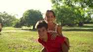 Happy Children, Friends, School Boy And Girl Playing Piggyback Stock Footage
