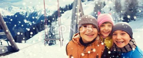 Happy children hugging over winter background Stock Photos