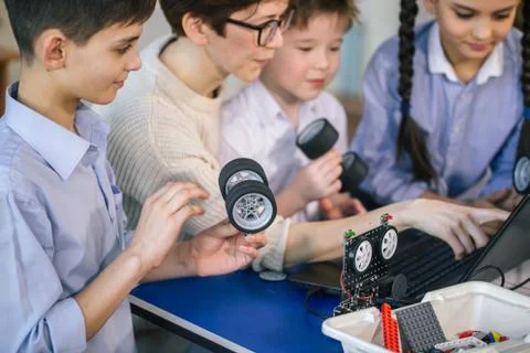 Happy children learn programming using laptops on extracurricular classes 스톡 사진