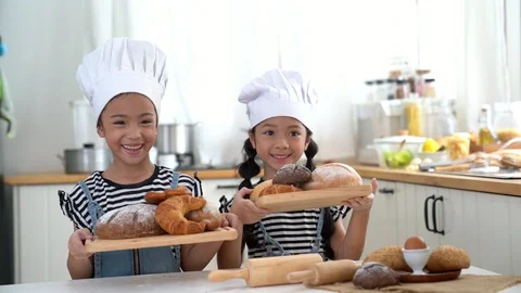 Happy children making bread in the kitchen Stock Footage 113513741