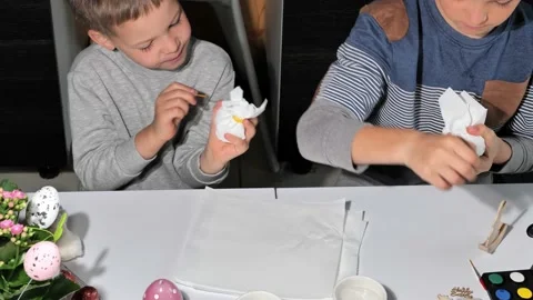 Happy children painting Easter eggs Stock Footage 163983013