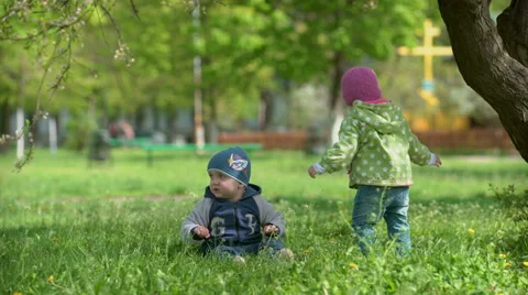 Happy children playing on grass Stock Footage 62500638