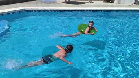 Happy children pool fun splash water happy summer kids splashing in pool kids Stock Footage 275271507