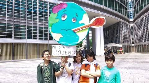 Happy children protesting with sick Earth picket sign, Friday for future day Видео 113648822