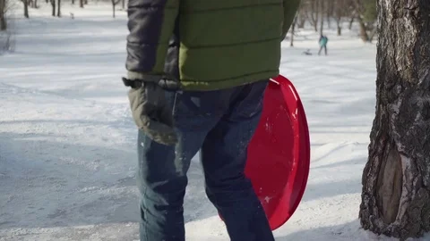 Happy children ride from a hill. Concept winter family holiday, healthy Stock Footage 72395341