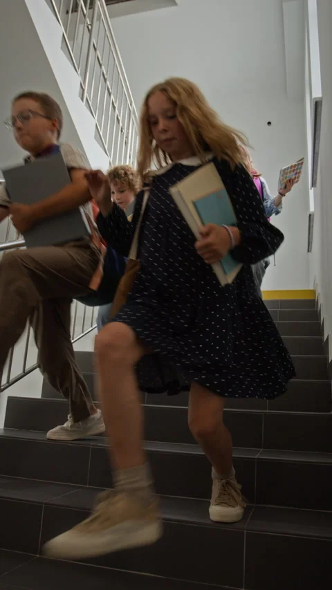 Happy Children Running down Stairs in Elementary School Stock Footage 345223329