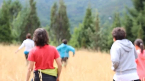 HAPPY CHILDREN RUNNING IN THE MOUNTAIN Stock Footage 93398381