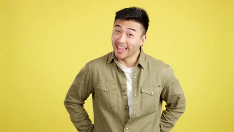 Happy chinese man looking at the camera giving a present Video stock 234859705