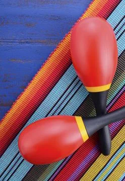 Happy Cinco de Mayo background with colorful maracas on Mexican theme dark .. Stock Photos
