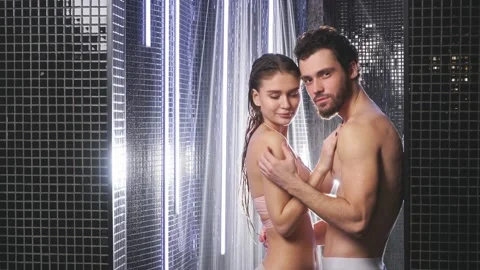 Happy clean couple after taking bath together in shower room Stock Footage 121493789