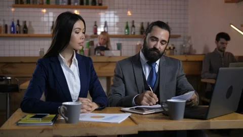 Happy client signing terms of real estate contract Video stock 100683925