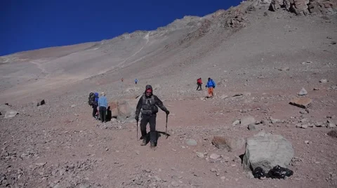 Happy climber is getting down from Aconcagua summit (Argentina, editorial) Stock Footage 58763831