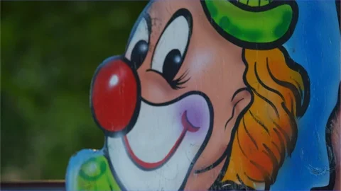 Happy clown face at sideshow, children Amusement carnival, county fair park Video stock 106691202