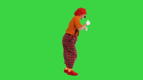 Happy clown show thumbs up while walking on a Green Screen, Chroma Key. 動画素材 147135337