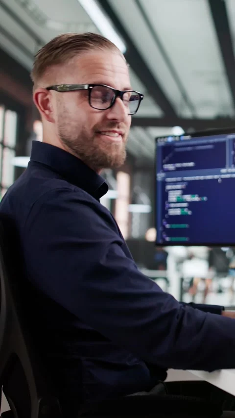 The Happy Coder: Man Working On Multiple Screens Stock Footage 321550101