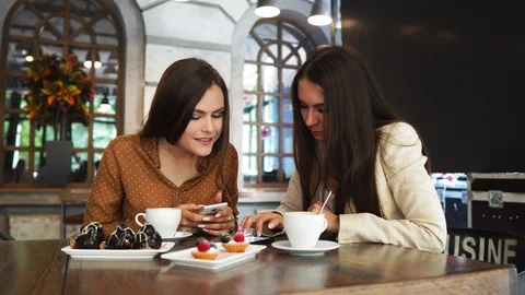 Happy colleagues from work socializing in restaurant and eating together Stock Footage