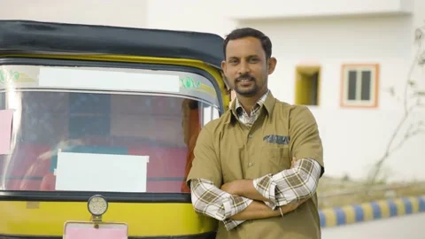 Happy confident smiling auto driver with crossed arms standing by looking at Stock Footage 168681980
