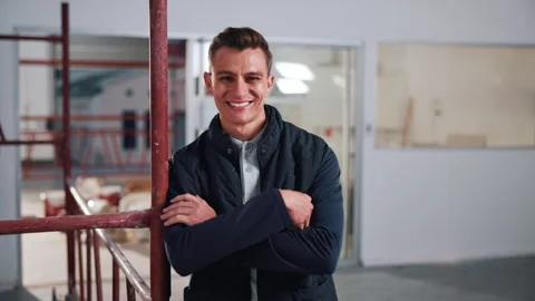 Happy, construction and face of man in building for evaluation, renovation and Stock Footage 341660728