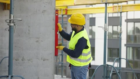 Happy construction worker dancing at building site Stock Footage 343449838