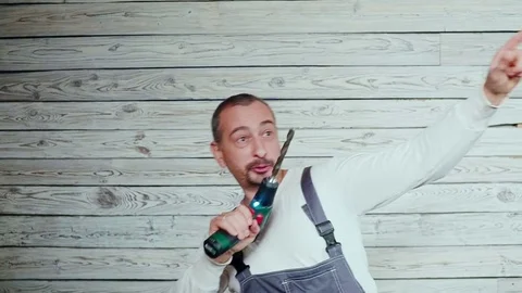 Happy construction worker with a drill in his hand dancing fun Video stock 84045994