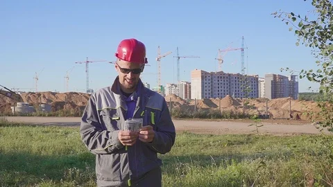 Happy construction worker with f dollars money at a construction site . Concept Stock Footage 111015505