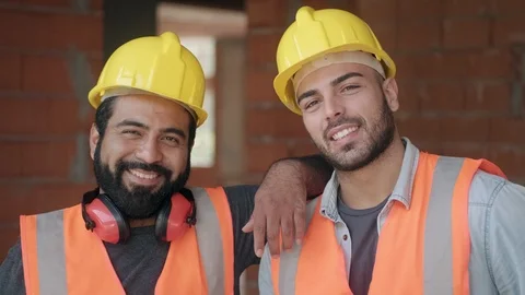 Happy Construction Workers Smiling At Camera In New Building Stock Footage