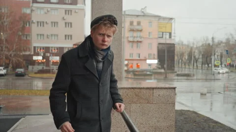 Happy content creator greets camera warmly outdoors. Optimistic individual on Video stock 338094401