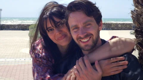 Happy couple after end of isolation and lockdown coronavirus smiling looking  Stock Footage 149756452