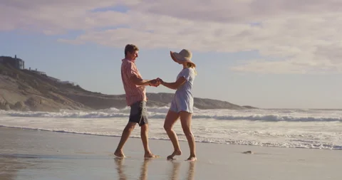 Happy, couple and beach with fun, holiday and tropical island with love, care Stock Footage 307701077