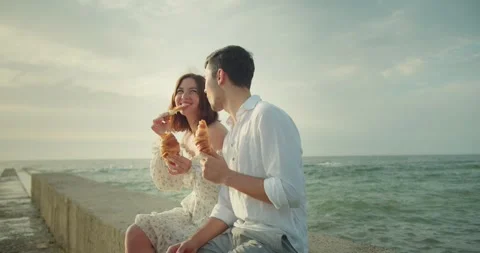 Happy couple a brunette guy in a white shirt together with his girlfriend in a Stock Footage 283834601