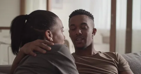 Happy couple chatting on sofa Stock Footage 181711468