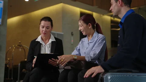 A happy couple checking in at the hotel reception Video stock 316367420