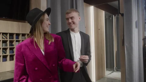 Happy couple dancing and having fun while shopping in clothing store Stock Footage 297471209