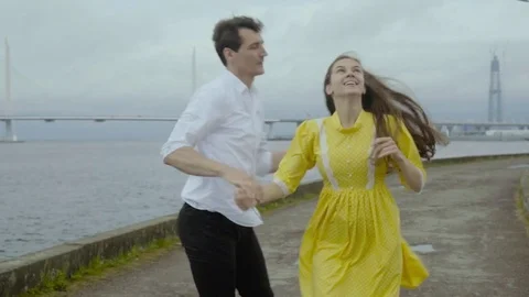 Happy couple dancing rock-n-roll dance at the embankment. Stock Footage 80921877