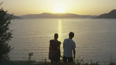 Happy couple dancing softly to the sun set. 4K slow motion.  Stock Footage 40459493